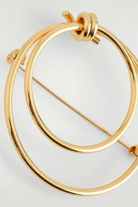 COS — Broche à finition nouée